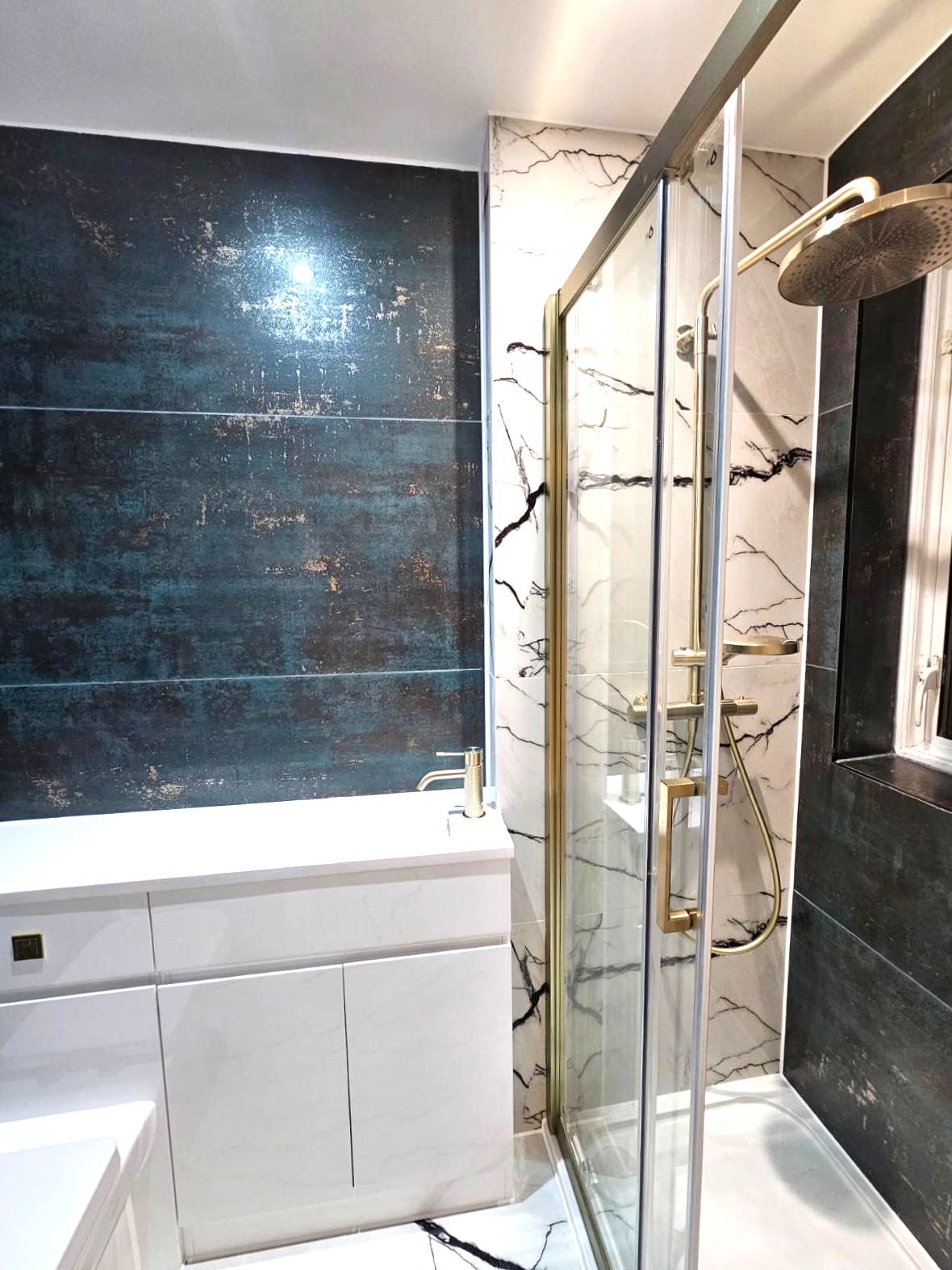 Modern bathroom with vanity, tiled walls and glass shower