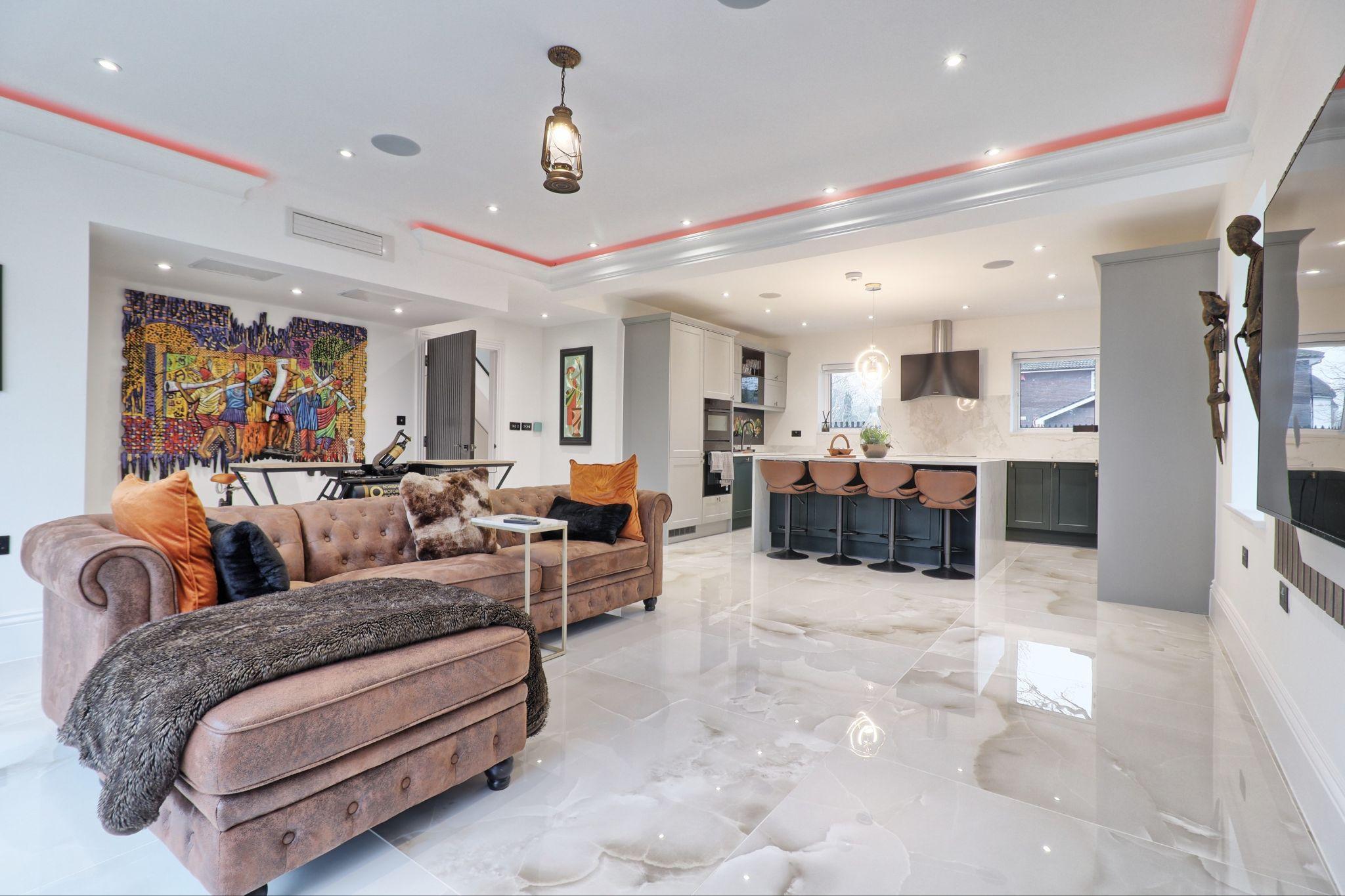 Open-plan living area and fitted kitchen after refurbishment